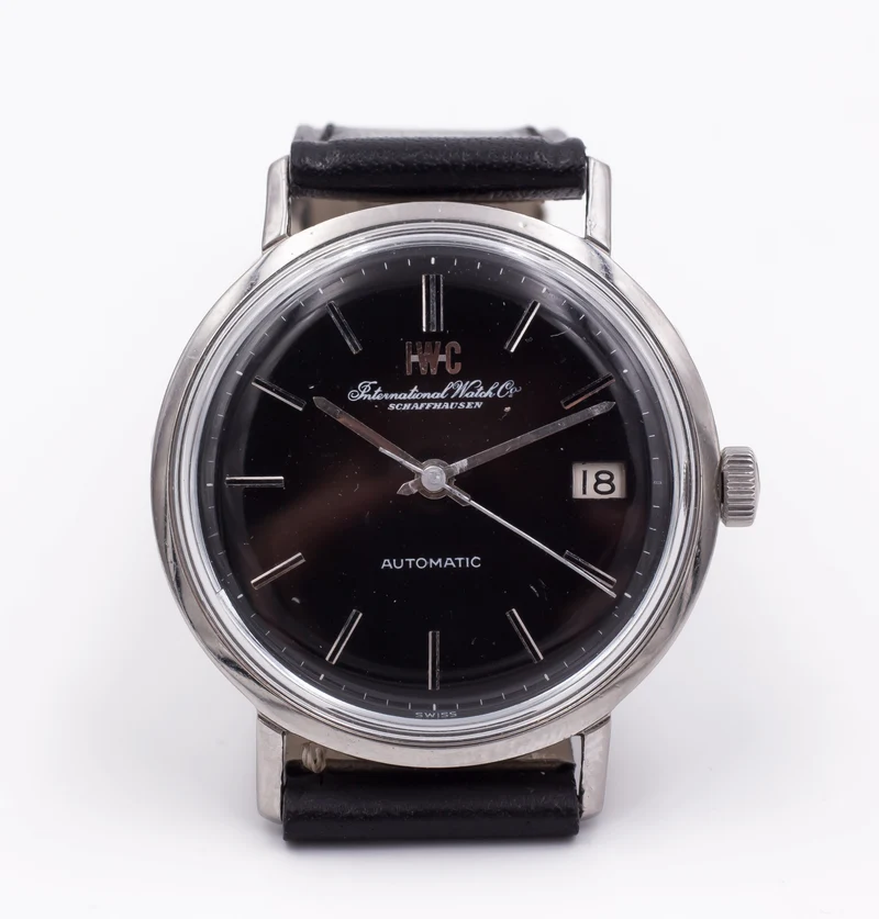 Montre bracelet vintage IWC International Watch Company en acier, automatique avec date. 1960 vers