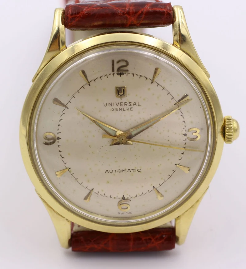 Montre-bracelet vintage universelle à marteau automatique (bumper) Geneve en or 18 carats. Années 50