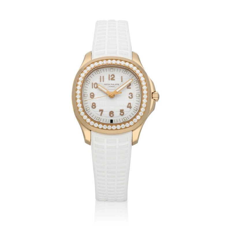 Patek Philippe Aquanaut Travel Time Reference 5269R-001, a rose gold quartz wristwatch with strap